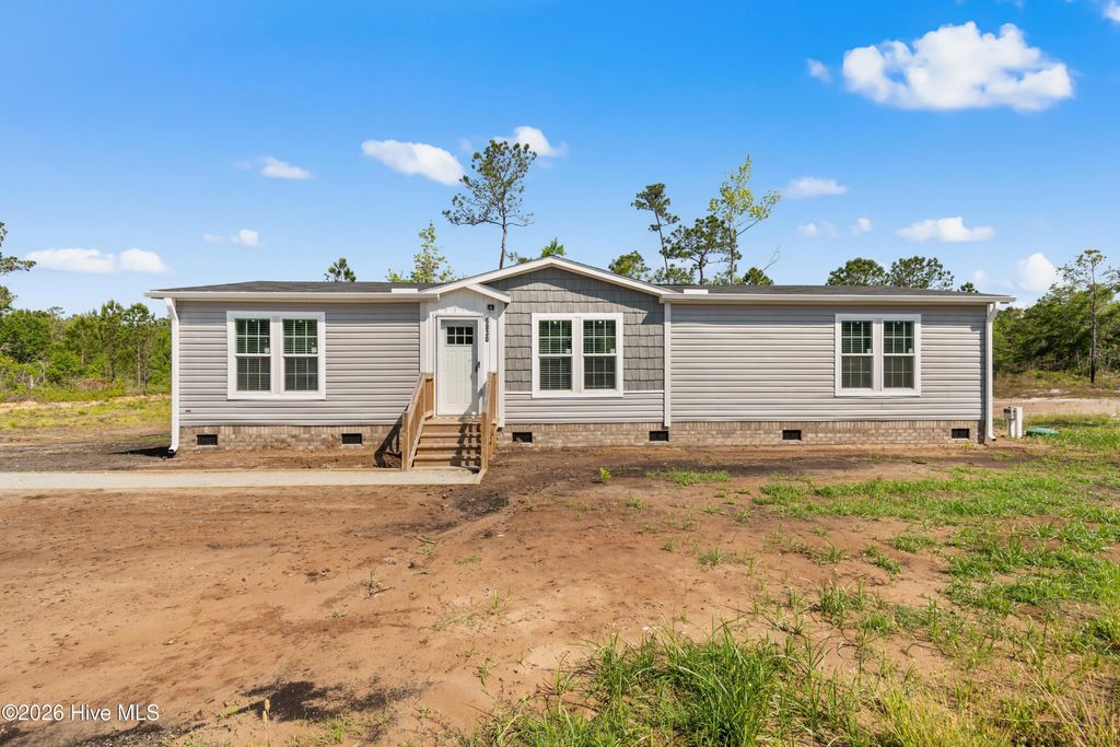 Photo of 6830 Lewis Drive SE, Winnabow, NC 28479 (MLS # 100575559)