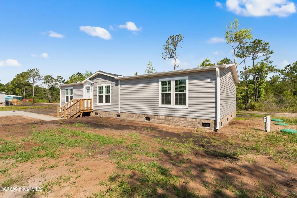 Photo of 6830 Lewis Drive SE, Winnabow, NC 28479 (MLS # 100575559)