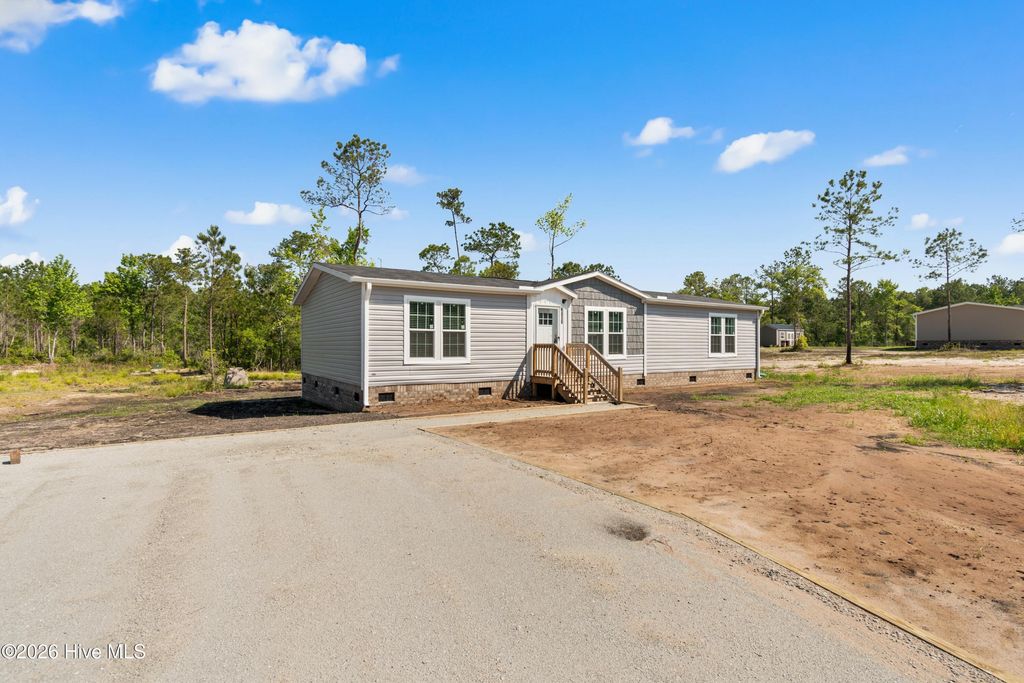 Photo of 6830 Lewis Drive SE, Winnabow, NC 28479 (MLS # 100575559)