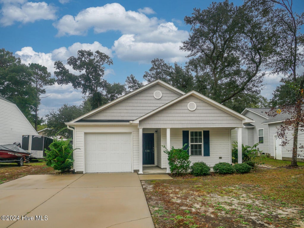 Photo of 126 NW 8th Street, Oak Island, NC 28465 (MLS # 100604490)