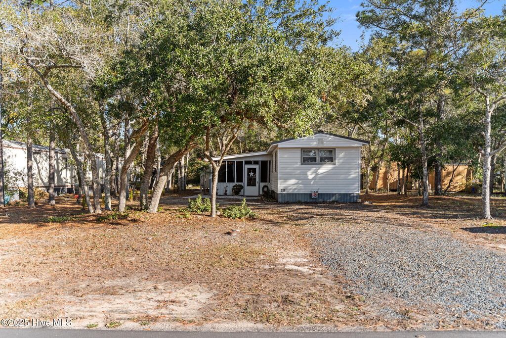 Photo of 220 NE 68th Street, Oak Island, NC 28465 (MLS # 100544898)