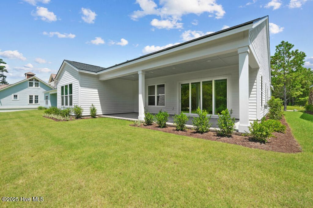 Photo of 6085 Ocean Isle Palms Way SW, Shallotte, NC 28470 (MLS # 100521312)