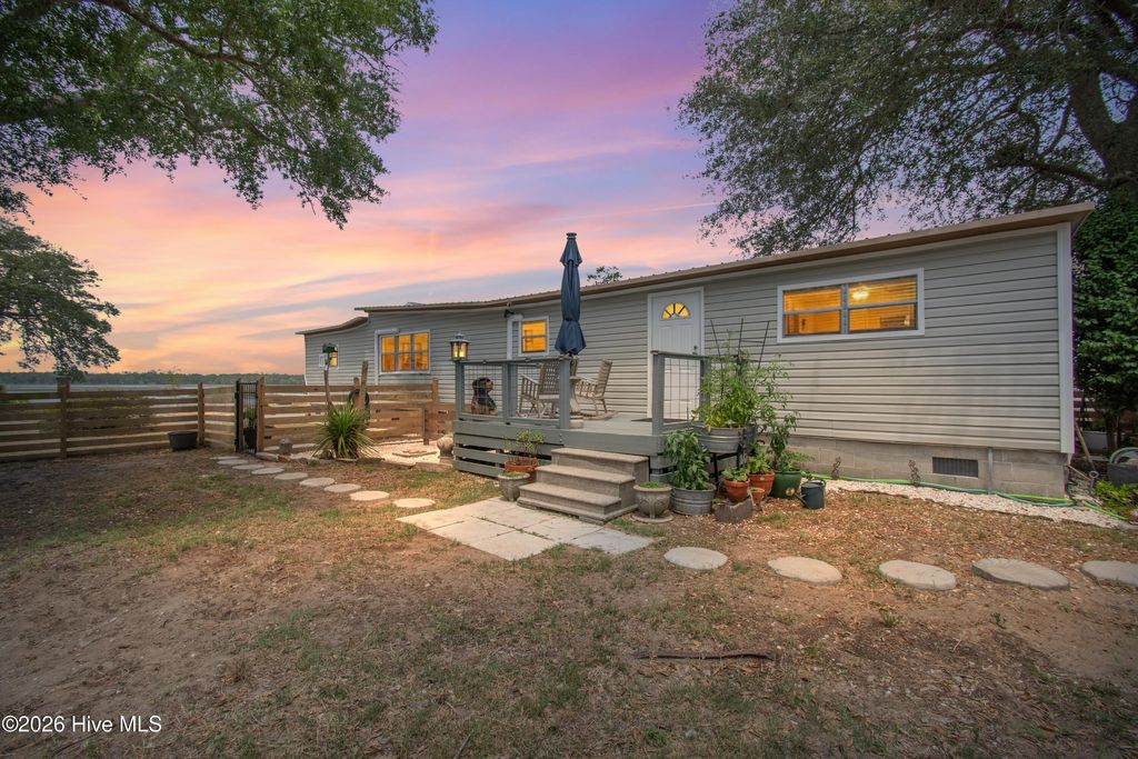 Photo of 7701 E Yacht Drive, Oak Island, NC 28465 (MLS # 100581003)