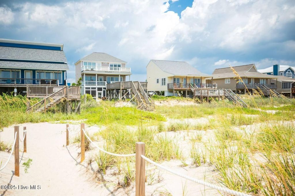 Photo of 1919 E Beach Drive, Oak Island, NC 28465 (MLS # 100484428)