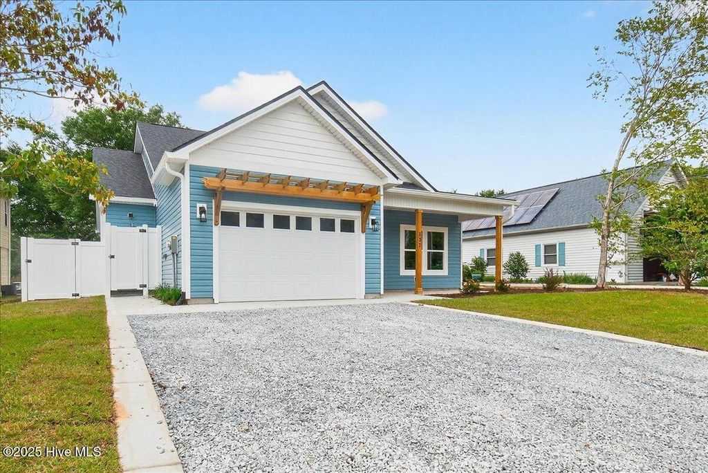 Photo of 137 NE 3rd Street, Oak Island, NC 28465 (MLS # 100531648)