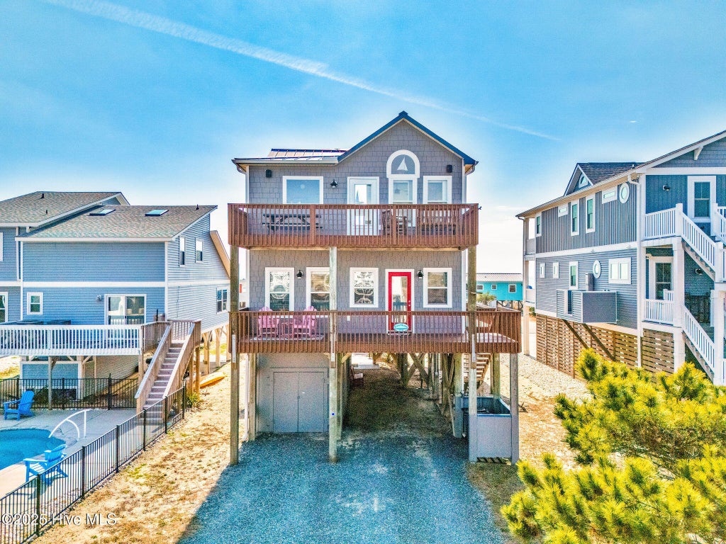 Photo of 318 E Beach Drive, Oak Island, NC 28465 (MLS # 100602742)
