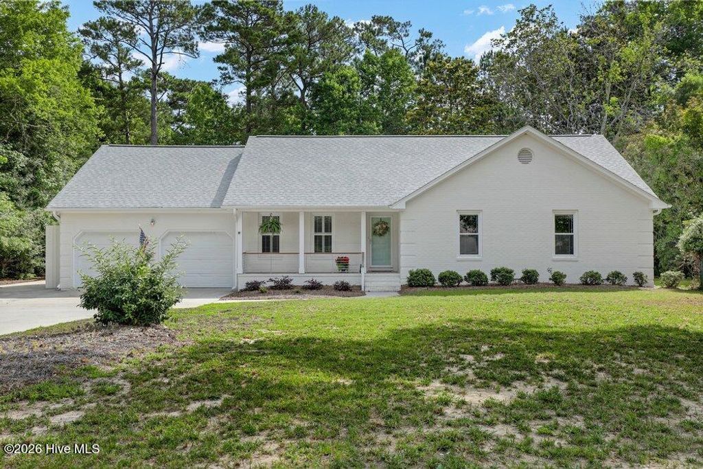 Photo of 709 Sawgrass Road, Hampstead, NC 28443 (MLS # 100577599)