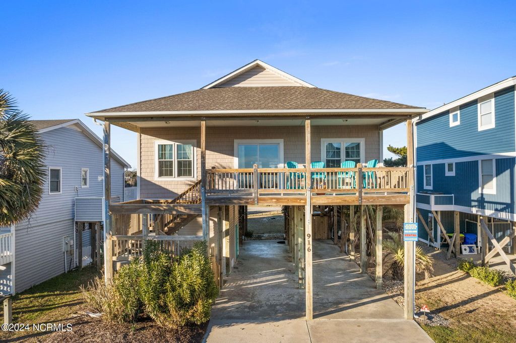 Photo of 916 E Dolphin Drive, Oak Island, NC 28465 (MLS # 100566939)