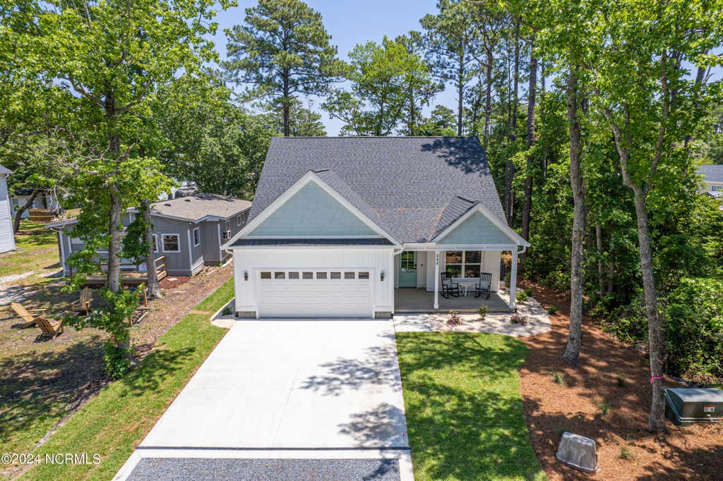 Photo of 230 NE 74th Street, Oak Island, NC 28465 (MLS # 100592816)