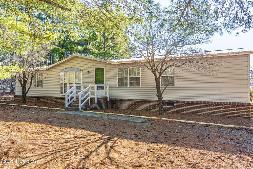 Photo of 660 Pinebluff Lake Road, Aberdeen, NC 28315 (MLS # 100545856)
