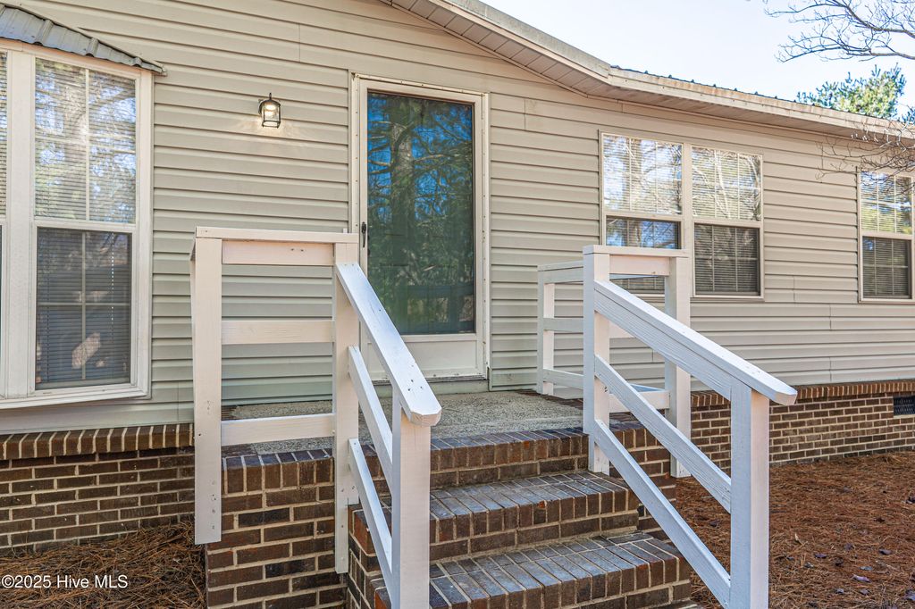 Photo of 660 Pinebluff Lake Road, Aberdeen, NC 28315 (MLS # 100545856)