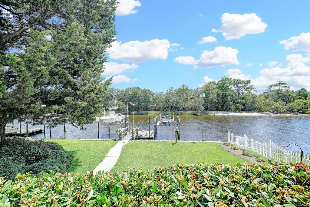 Photo of 115 SW Yacht Drive, Oak Island, NC 28465 (MLS # 100573179)