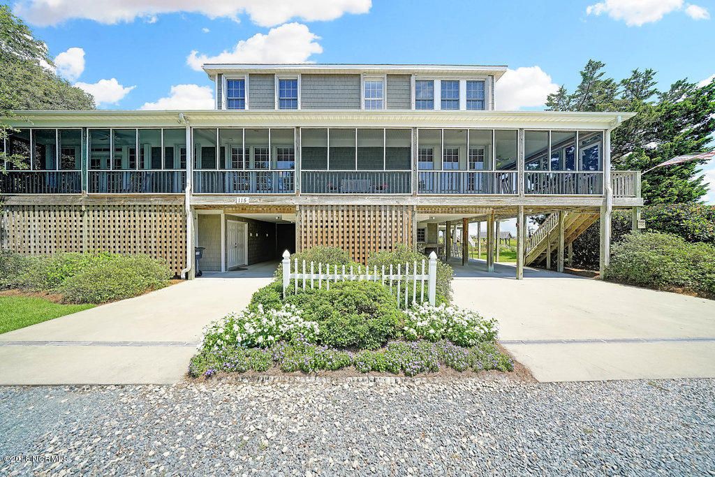 Photo of 115 SW Yacht Drive, Oak Island, NC 28465 (MLS # 100573179)