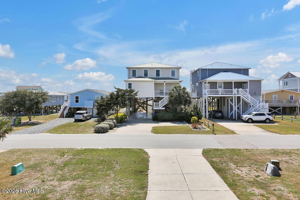 Photo of 118 W Dolphin Drive, Oak Island, NC 28465 (MLS # 100565368)