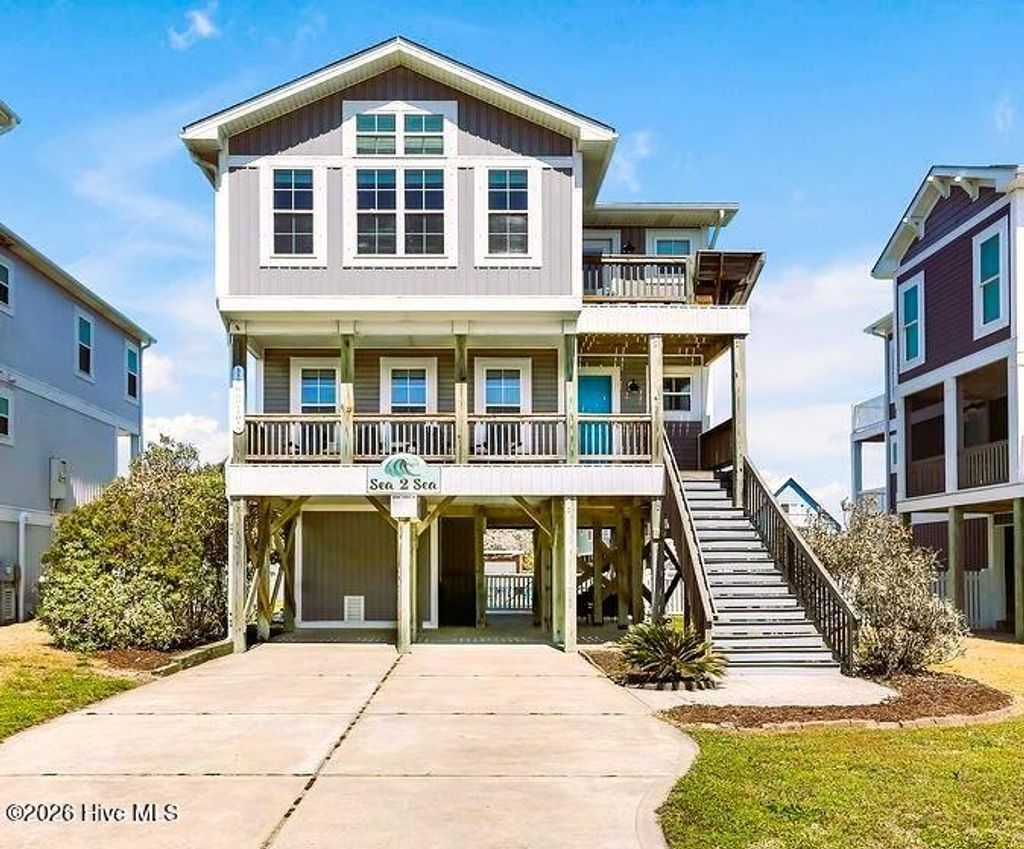 Photo of 118 W Dolphin Drive, Oak Island, NC 28465 (MLS # 100565368)