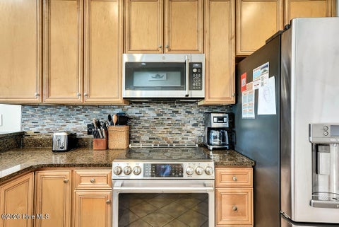 Tiny photo for 700 Ocean Drive #Unit 104, Oak Island, NC 28465 (MLS # 100606188)