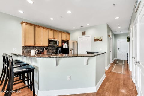 Tiny photo for 700 Ocean Drive #Unit 104, Oak Island, NC 28465 (MLS # 100606188)