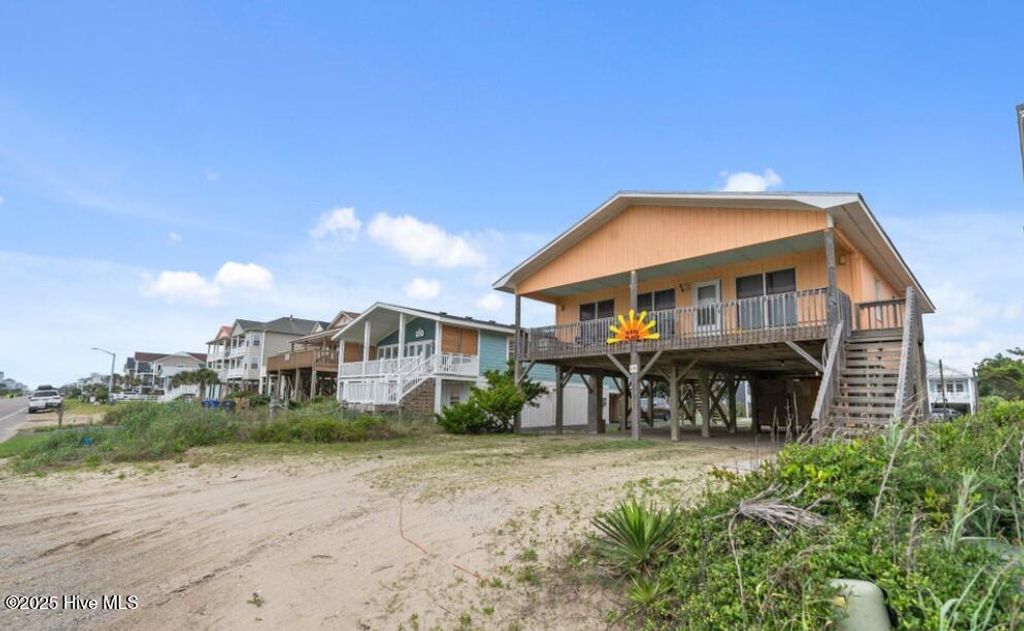 Photo of 210 W Beach Drive, Oak Island, NC 28465 (MLS # 100513901)