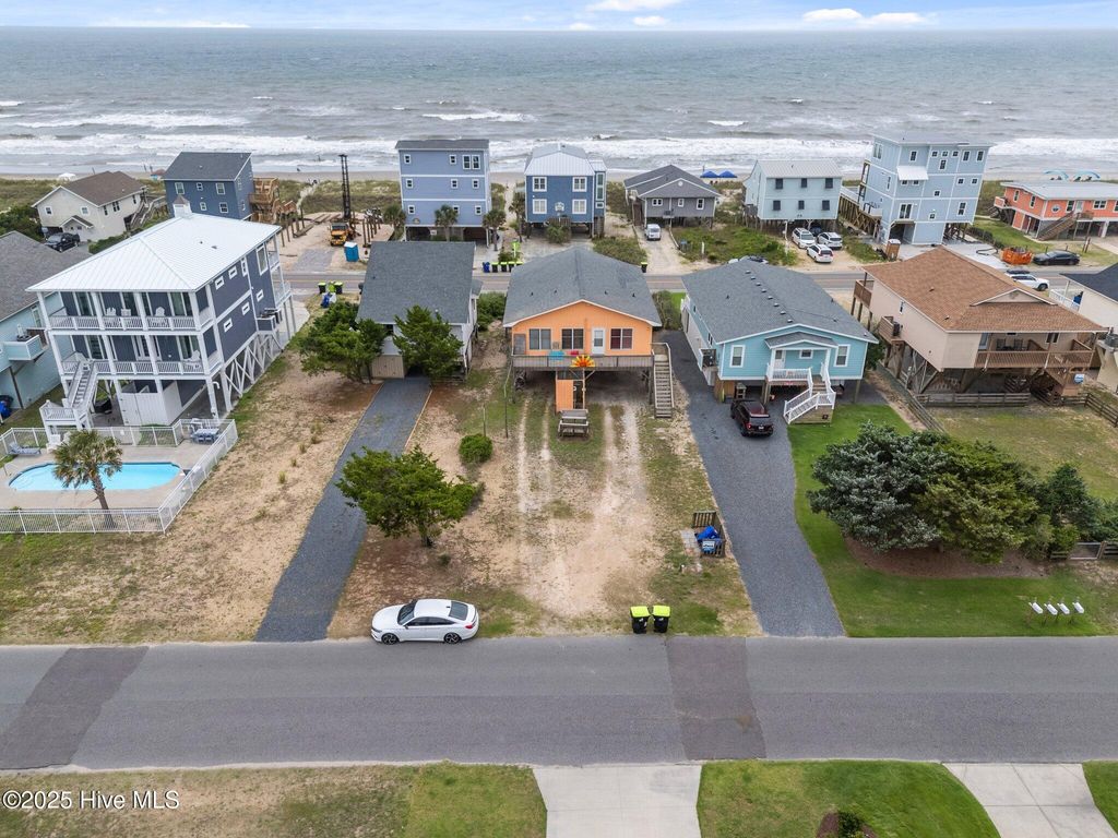 Photo of 210 W Beach Drive, Oak Island, NC 28465 (MLS # 100513901)