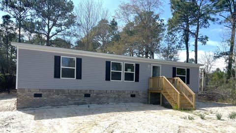 Photo of 1451 Mockingbird Place SW, Shallotte, NC 28470 (MLS # 100563210)