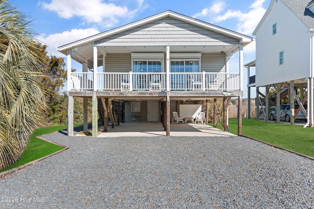 Photo of 316 E Dolphin Drive, Oak Island, NC 28465 (MLS # 100555646)