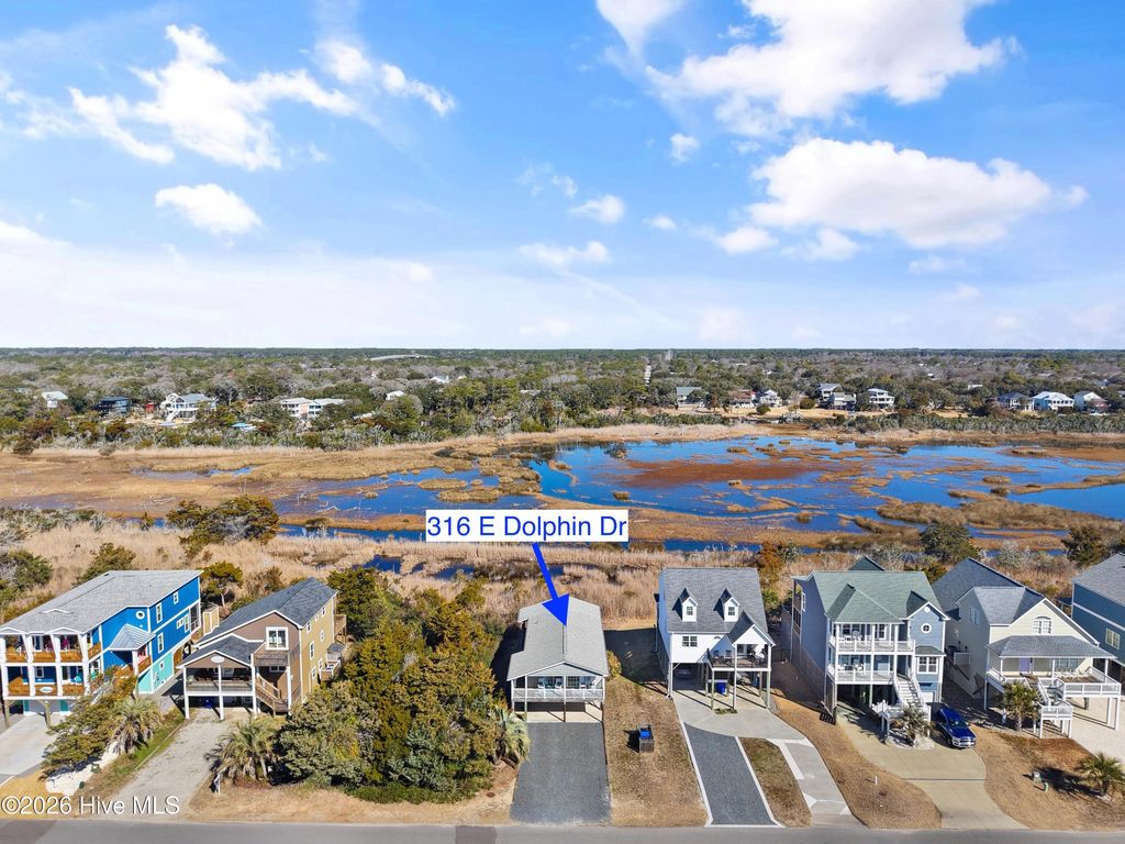 Photo of 316 E Dolphin Drive, Oak Island, NC 28465 (MLS # 100555646)