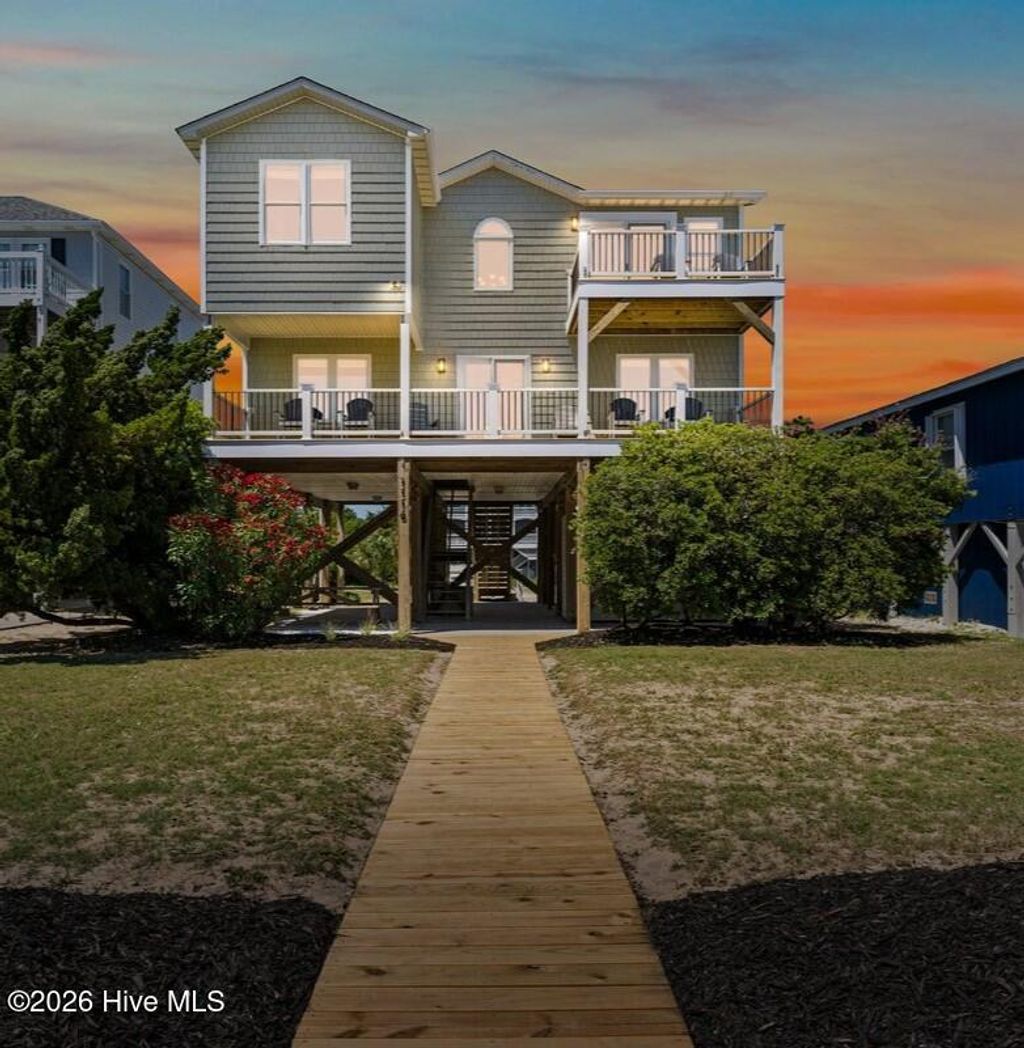 Photo of 1116 E Beach Drive, Oak Island, NC 28465 (MLS # 100558886)