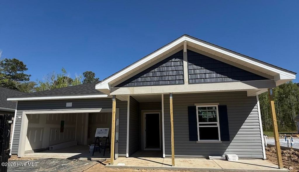 Photo of 7127 Woodline Drive SW, Sunset Beach, NC 28468 (MLS # 100564822)