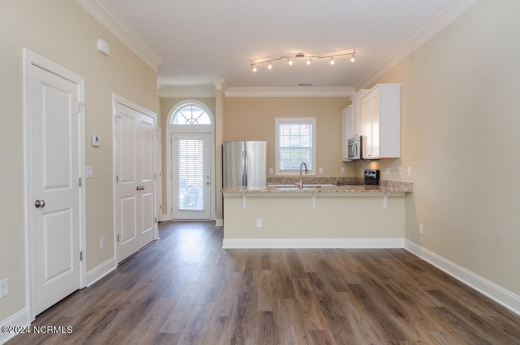 Photo of 4954 Exton Park Loop, Castle Hayne, NC 28429 (MLS # 100572509)
