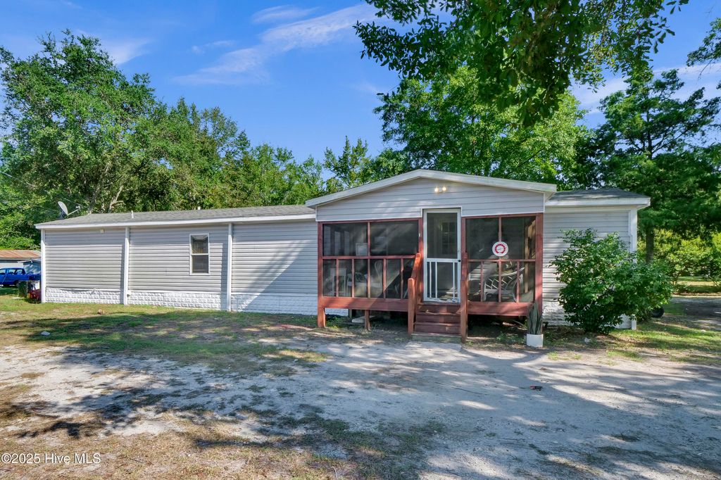 Photo of 215 Anderson Drive, Hampstead, NC 28443 (MLS # 100522648)