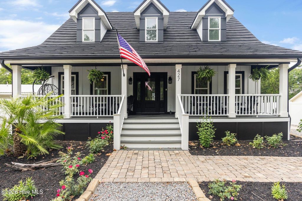 Photo of 427 Womble Street, Oak Island, NC 28465 (MLS # 100582473)
