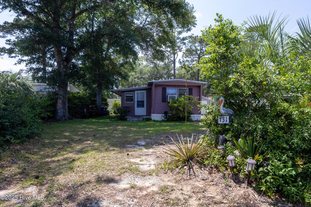 Photo of 131 NE 75th Street, Oak Island, NC 28465 (MLS # 100516366)