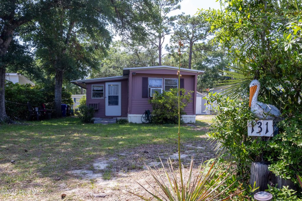 Photo of 131 NE 75th Street, Oak Island, NC 28465 (MLS # 100516366)