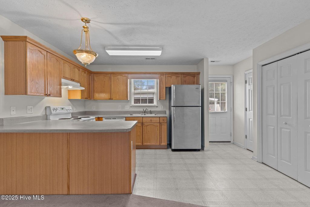 Photo of 135 NE 15th Street, Oak Island, NC 28465 (MLS # 100526319)