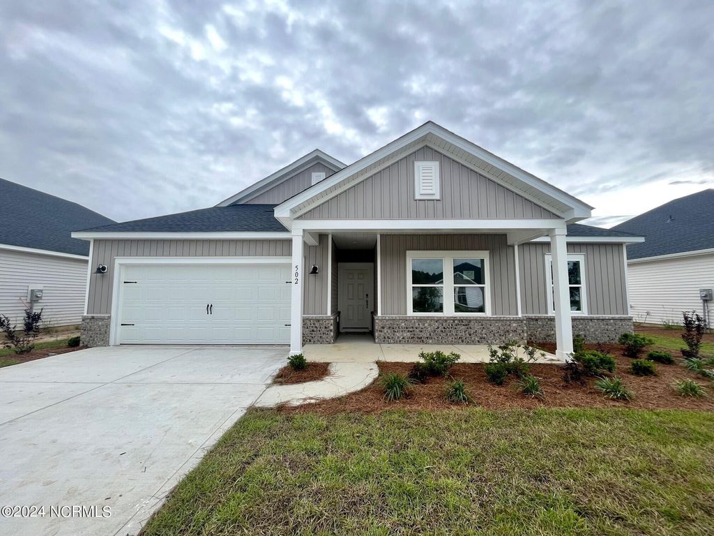 Photo of 502 Forthlin Drive NW, Calabash, NC 28467 (MLS # 100433505)