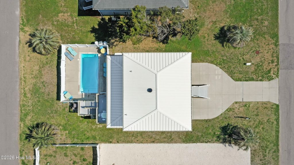 Photo of 1018 W Dolphin Drive, Oak Island, NC 28465 (MLS # 100559686)