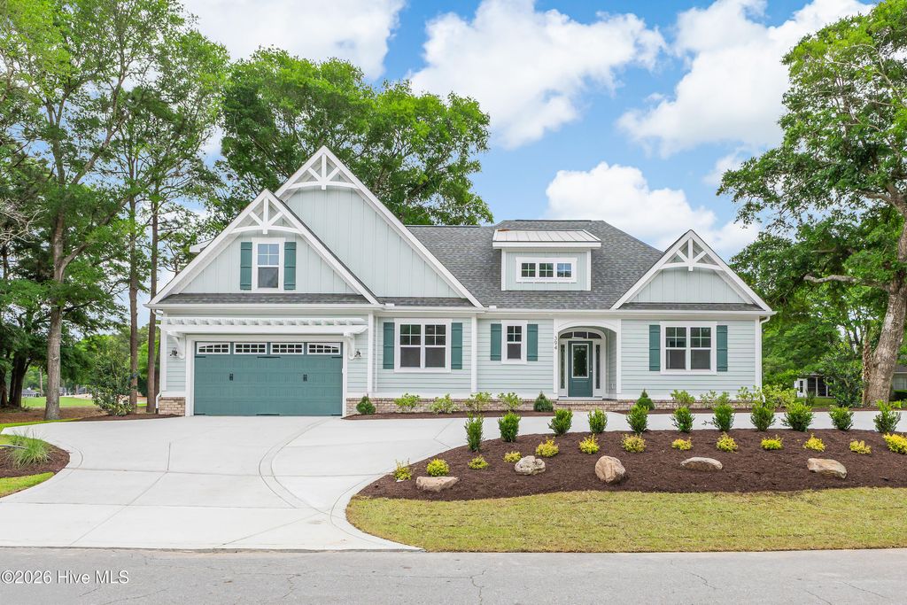 Photo of 394 Sea Trail Drive W, Sunset Beach, NC 28468 (MLS # 100576128)