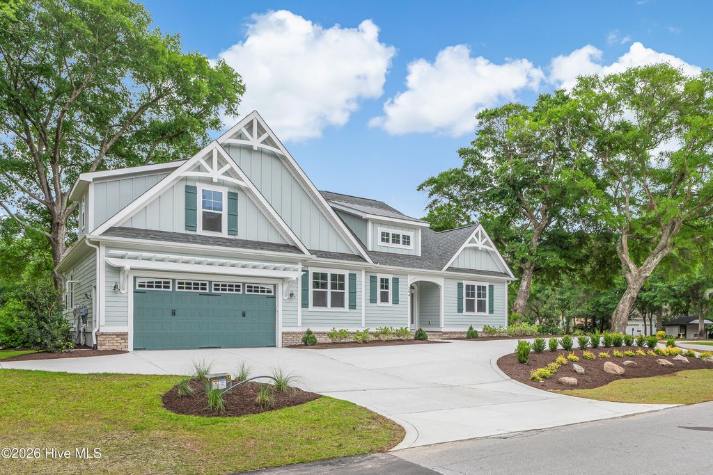 Photo of 394 Sea Trail Drive W, Sunset Beach, NC 28468 (MLS # 100576128)
