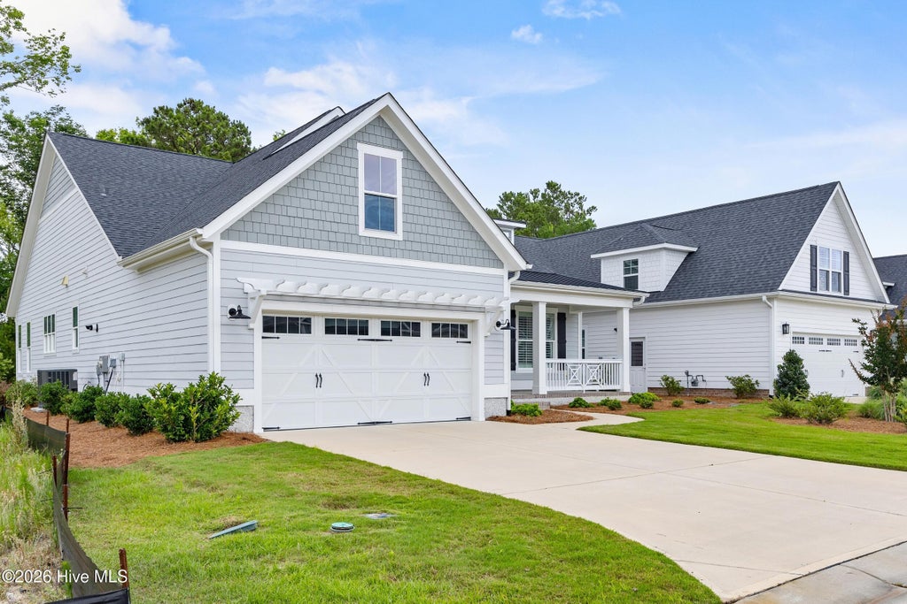 Photo of 3386 Island Lakes Drive, Oak Island, NC 28461 (MLS # 100578703)