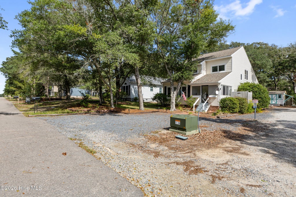 Photo of 122 SE 2nd Street, Oak Island, NC 28465 (MLS # 100609200)