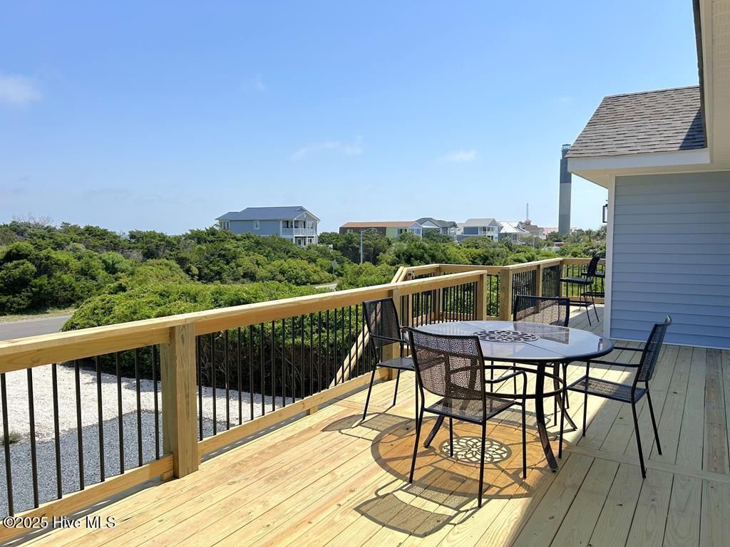 Photo of 323 Caswell Beach Road, Oak Island, NC 28465 (MLS # 100533817)