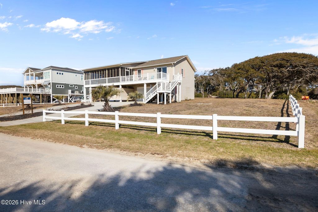Photo of 100 Ocean Drive, Oak Island, NC 28465 (MLS # 100553984)