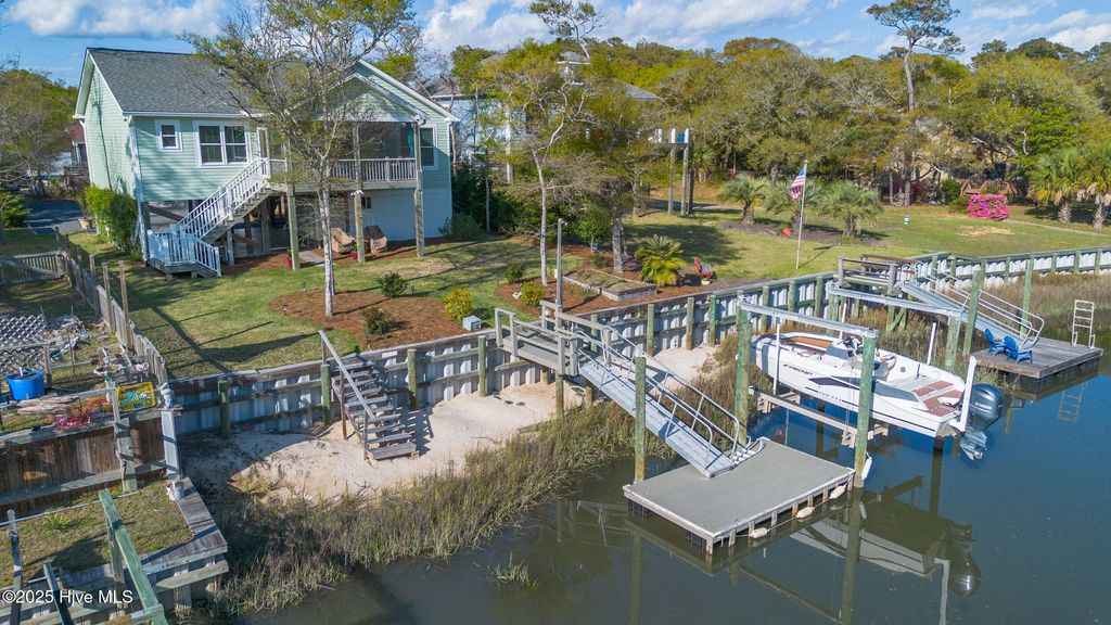 Photo of 107 SW 25th Street, Oak Island, NC 28465 (MLS # 100559807)