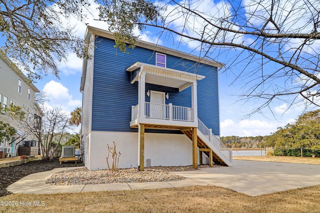 Photo of 102 SW Yacht Drive, Oak Island, NC 28465 (MLS # 100556929)