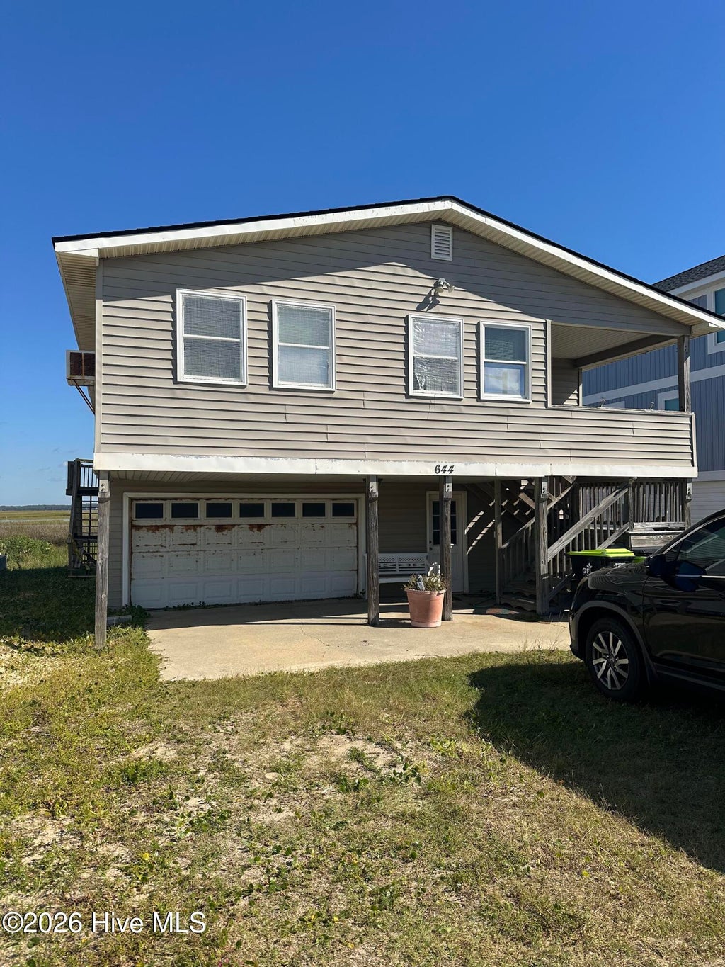 Photo of 644 Caswell Beach Road, Caswell Beach, NC 28465 (MLS # 100606853)