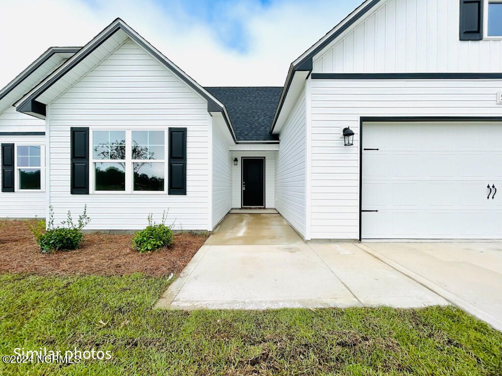 Photo of 136 Tides End Drive, Holly Ridge, NC 28445 (MLS # 100517766)