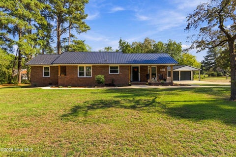 Photo of 4602 Lake Wilson Road, Elm City, NC 27822 (MLS # 100610390)