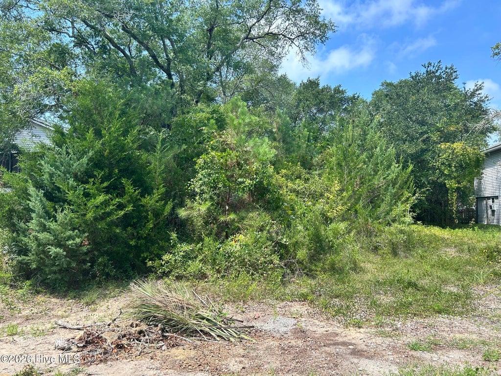 Photo of 105 SE 8th Street, Oak Island, NC 28465 (MLS # 100598080)