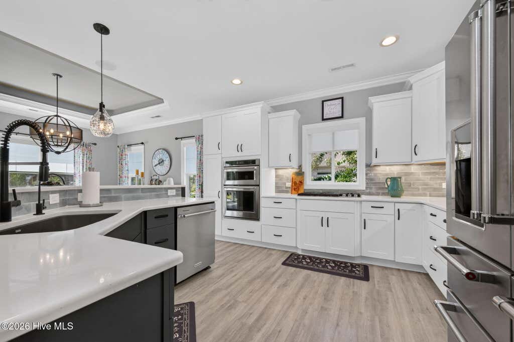 Photo of 8629 Hammocks Cove Trail NE, Leland, NC 28451 (MLS # 100596480)