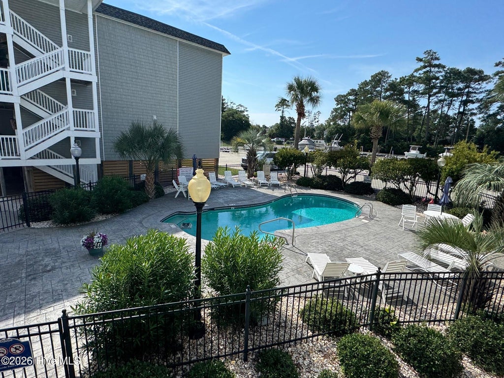 Photo of 5400 E Yacht Drive #Apt A7, Oak Island, NC 28465 (MLS # 100599641)